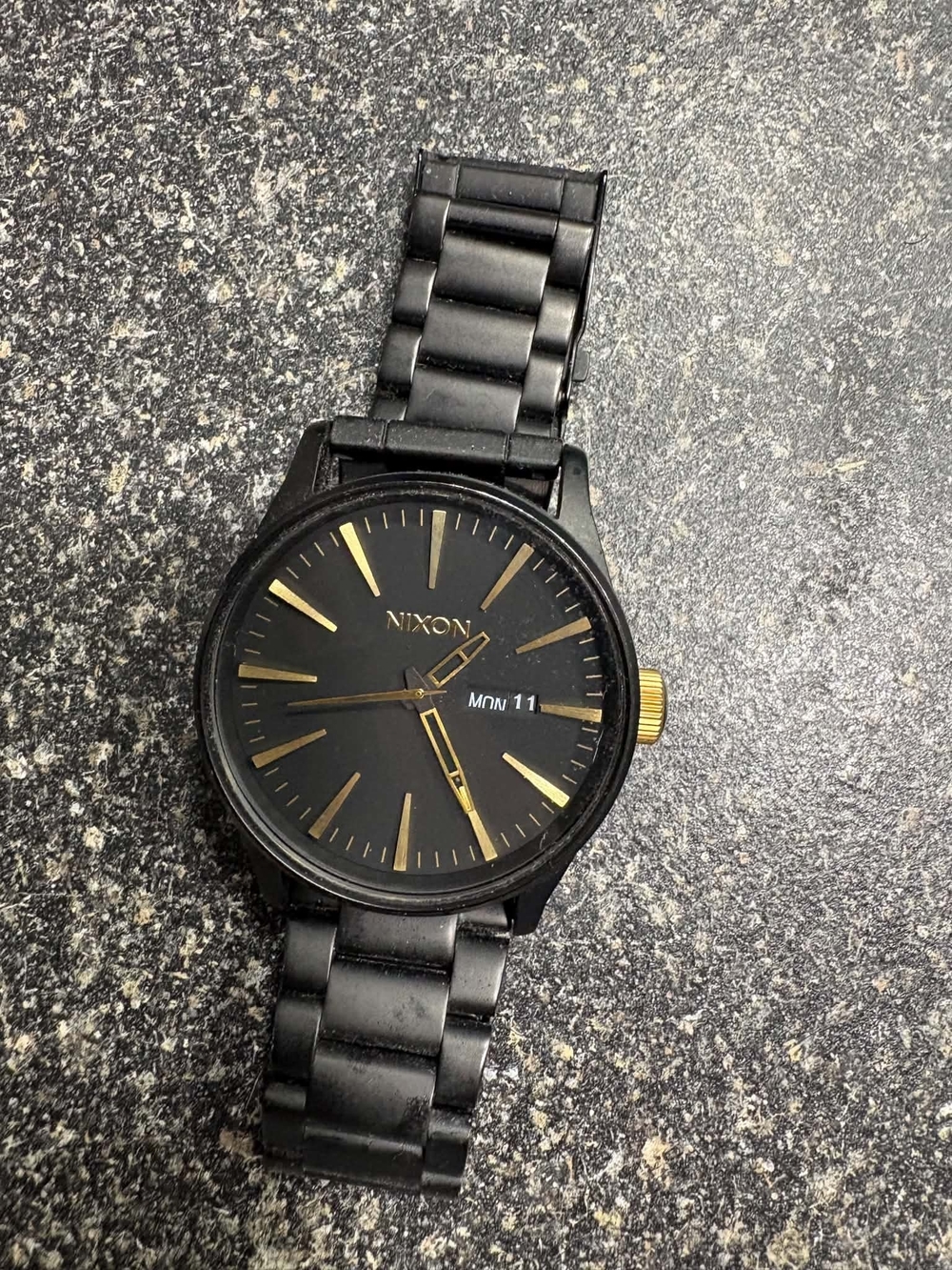 Nixon Black and Gold Accent Men's Watch